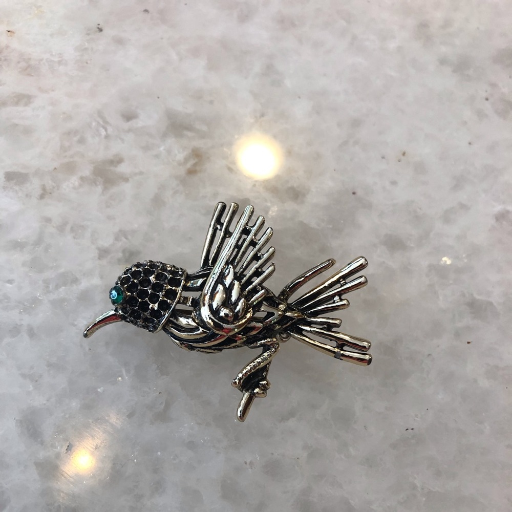 Vintage Goldtone and Black Hummingbird Pin/Brooch with green eye. Approx 2” long